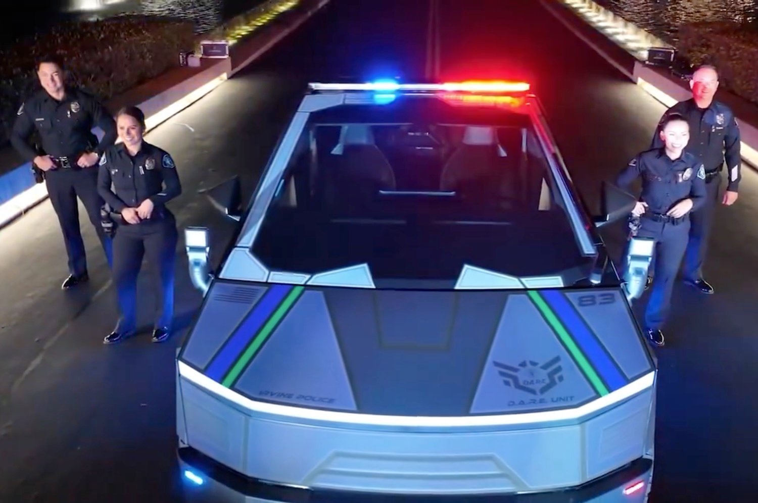 Irvine Police officers pose in front of the department's new Tesla Cybertruck in a promotional video from Oct. 8, 2024.