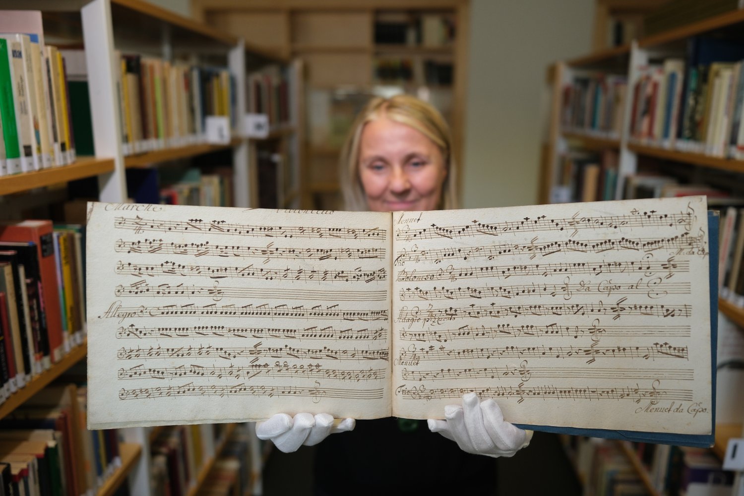 A Leipzig Municipal Libraries worker holds the lost Mozart manuscript.