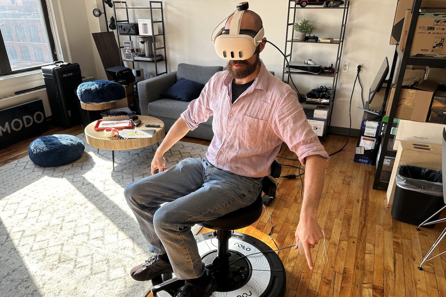 A person sitting in a Roto VR Chair with a Meta Quest 3 headset