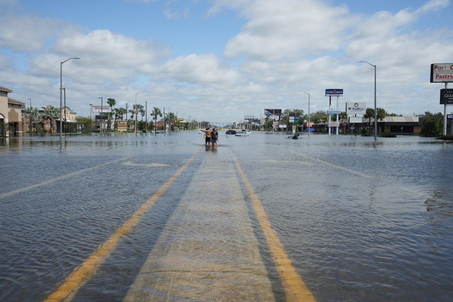 Water begins to recede from flooded streets in Tampa, Florida, due to Hurricane Milton on October 10, 2024. Hurricane Milton tore a coast-to-coast path of destruction across the US state of Florida, whipping up a spate of deadly tornadoes that left at least four people dead, but avoiding the catastrophic devastation officials had feared. (Photo by Bryan R. SMITH / AFP) (Photo by BRYAN R. SMITH/AFP via Getty Images)