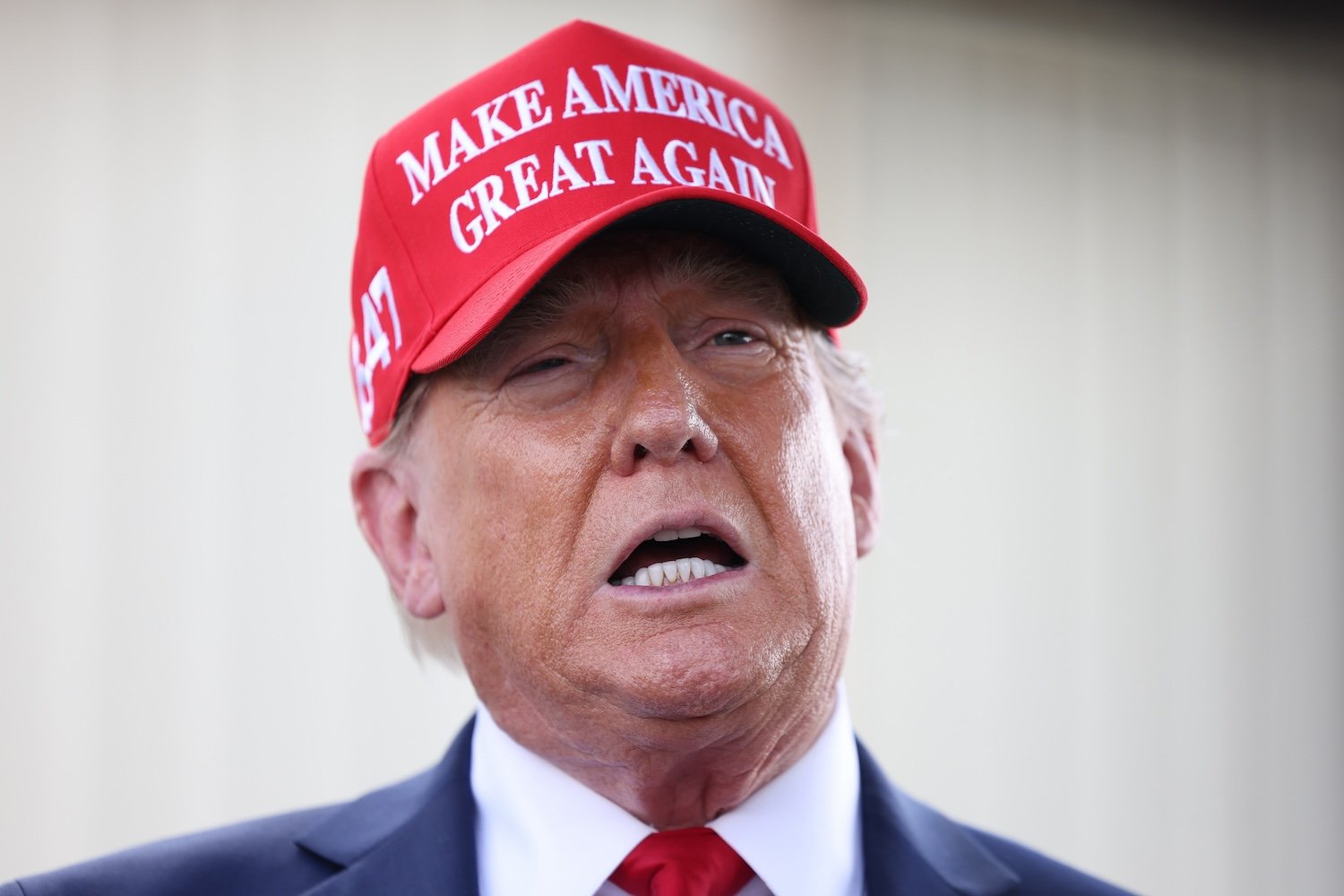 Donald Trump gives brief statements as he arrives at Valdosta Regional Airport to visit areas affected by Hurricane Helene on September 30, 2024 in Valdosta, Georgia.